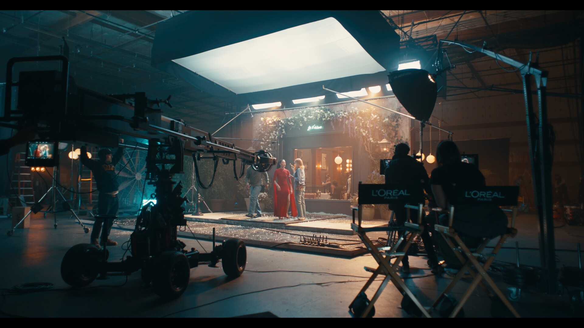 A stunt performer in a red dress on a movie set