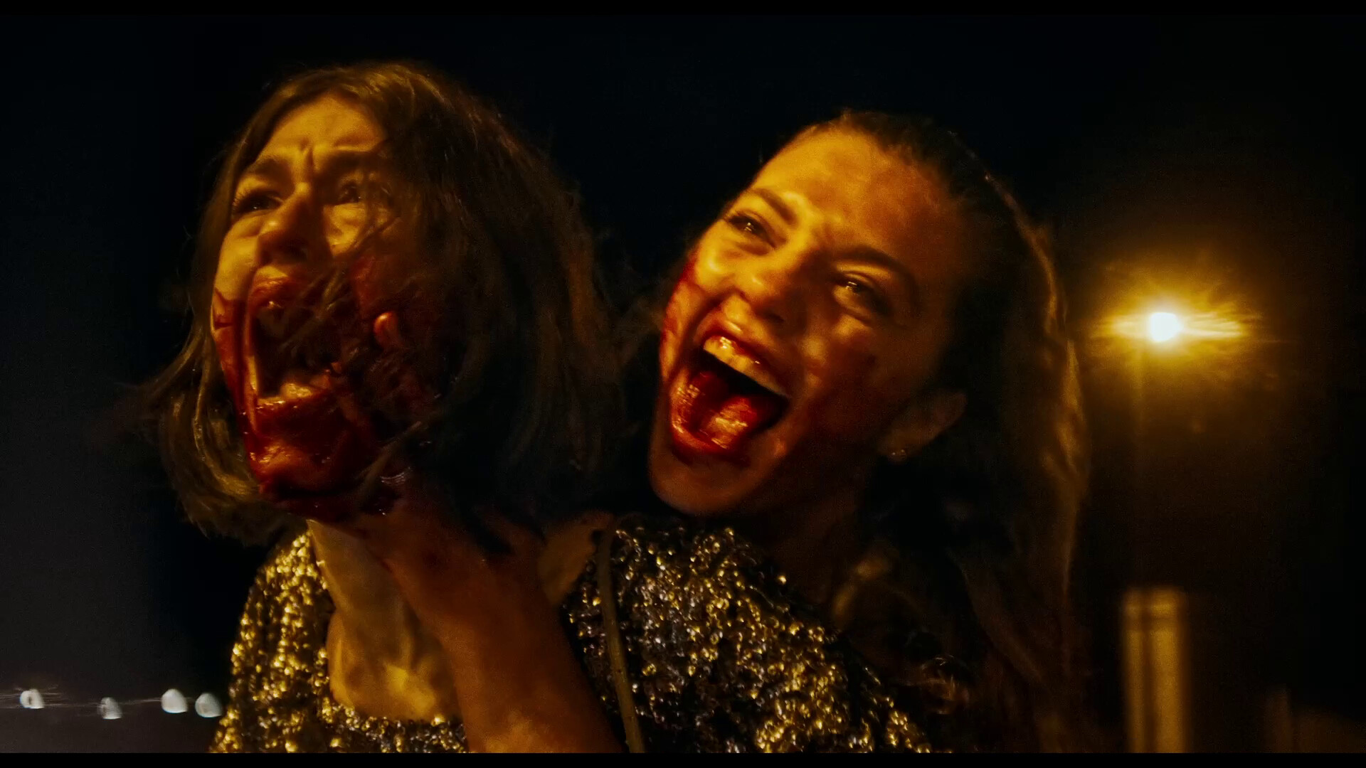 Two girls screaming with bloody faces