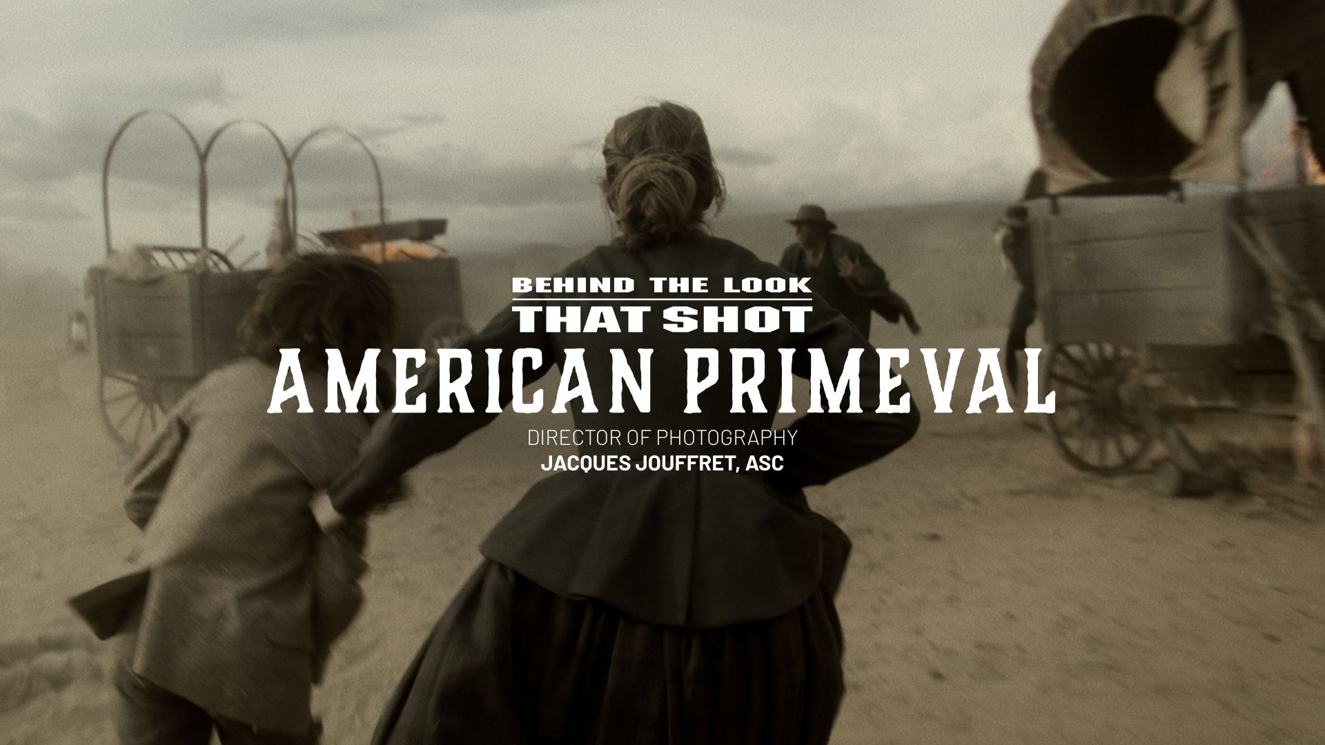 a woman and a child facing away from the camera with covered wagons on fire in the background