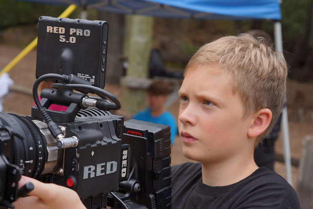 Young boy holding RED EPIC