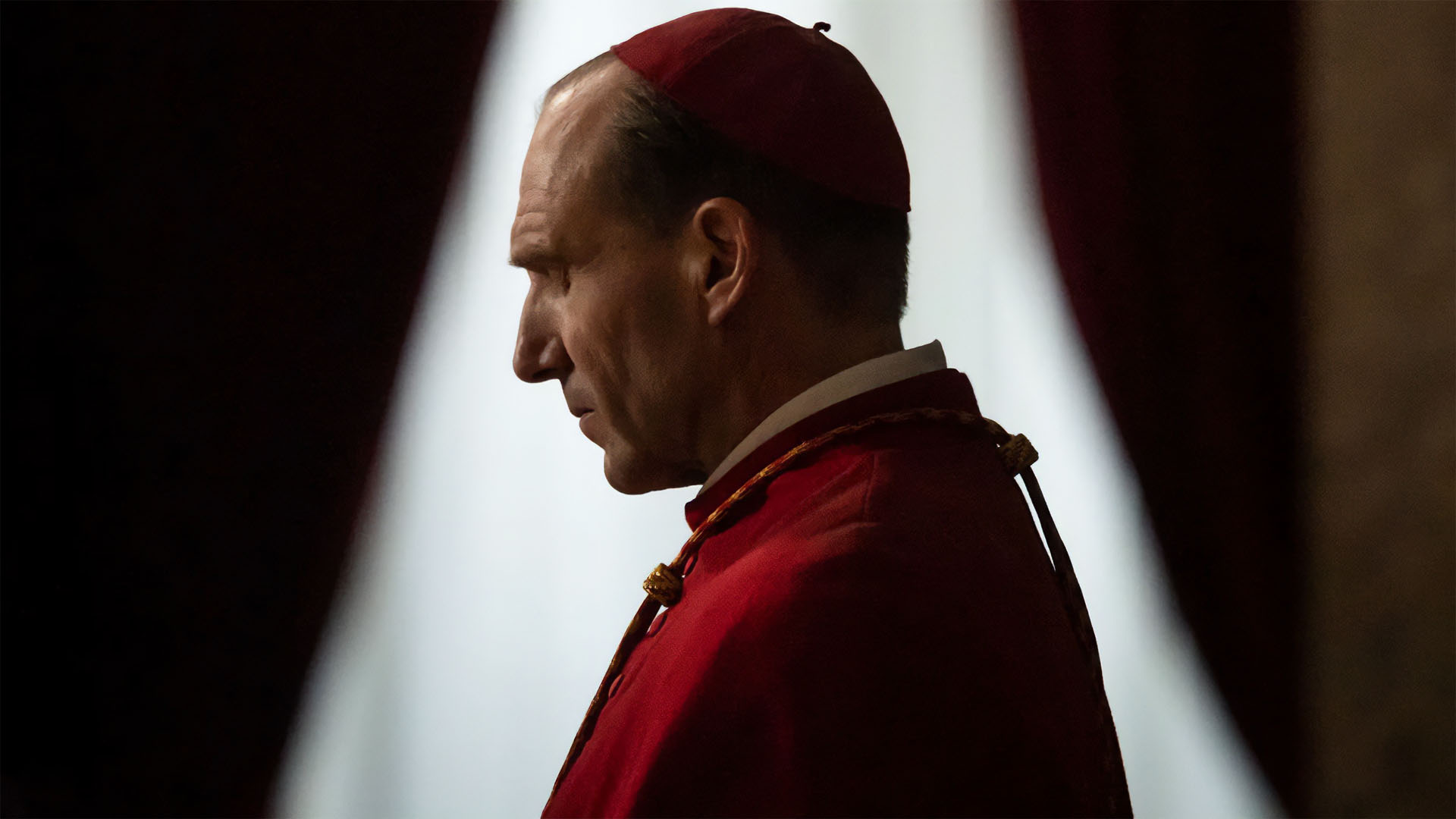profile of a Vatican bishop in red robes