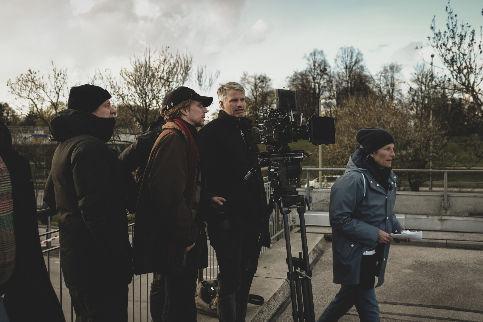 Tim Fehlbaum and Markus Förderer standing behind a camera on a tripod
