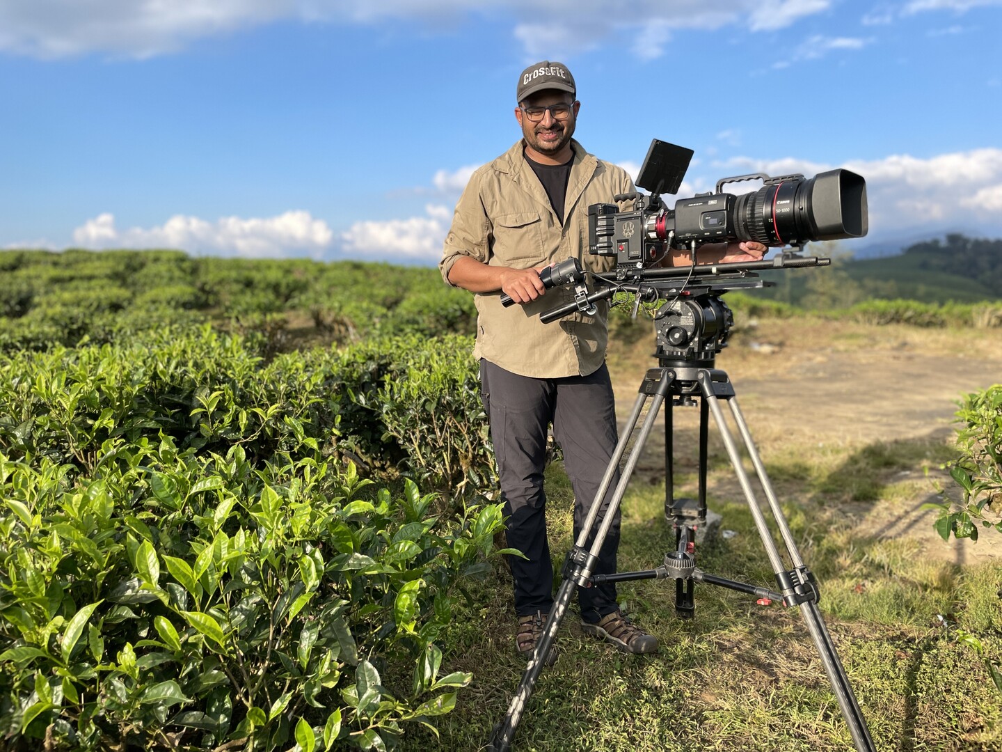 Camera operator with tripod