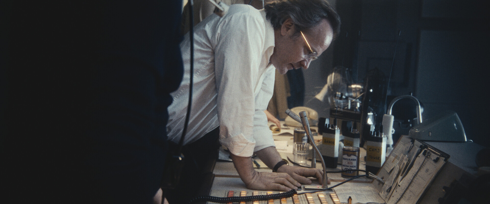 a man leaning over a microphone